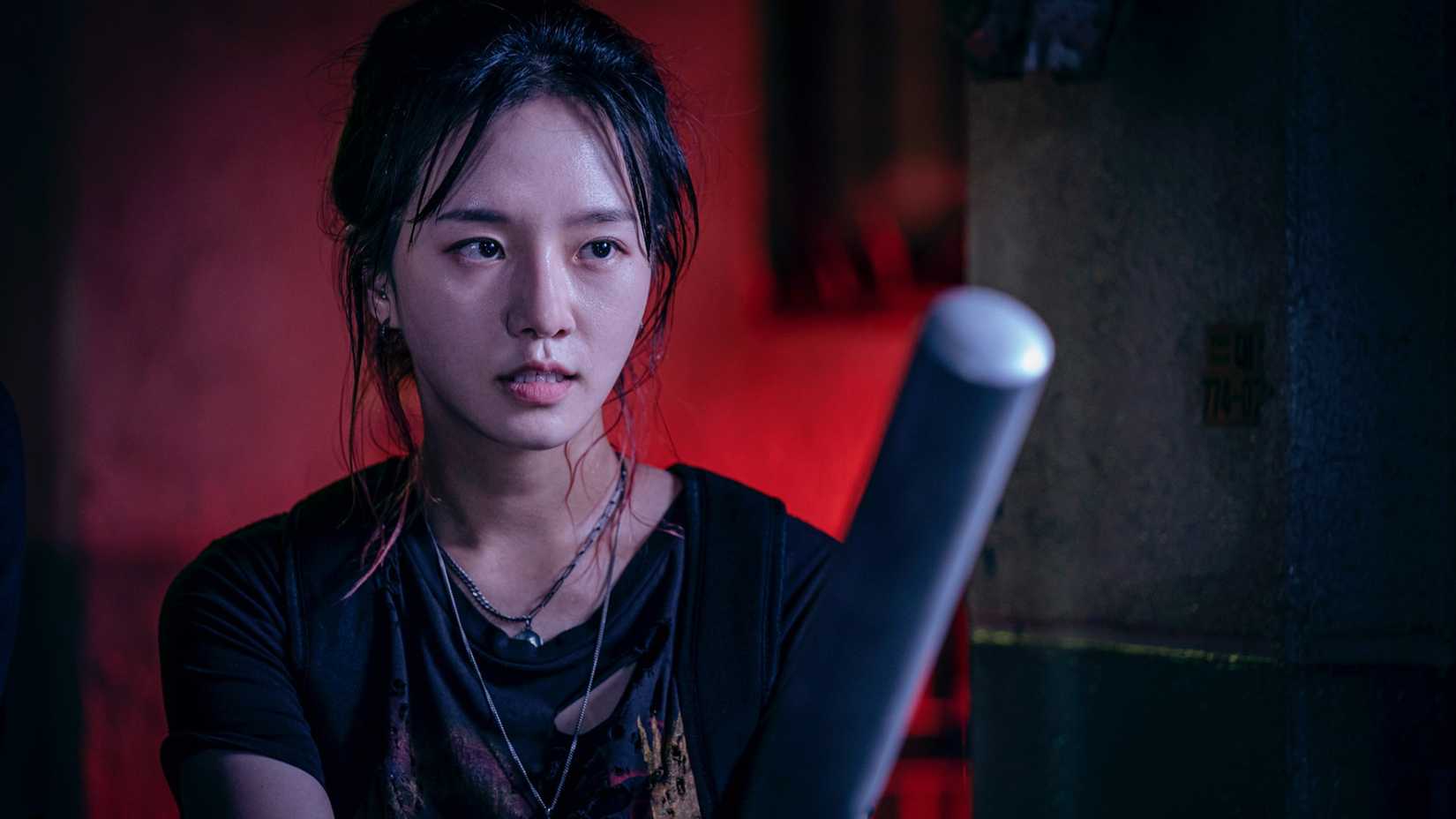 A woman with a bat in Netflix's Korean zombie drama Sweet Home.