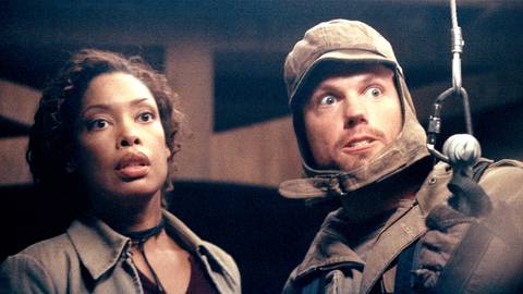 Gina Torres as Zoe Alleyne Washburne and Adam Baldwin as Jayne Cobb looking scared in Firefly