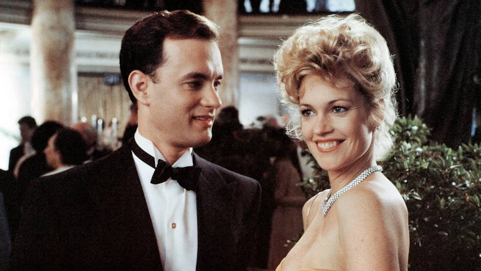 Tom Hanks smiles at Melanie Griffith in The Bonfire of the Vanities