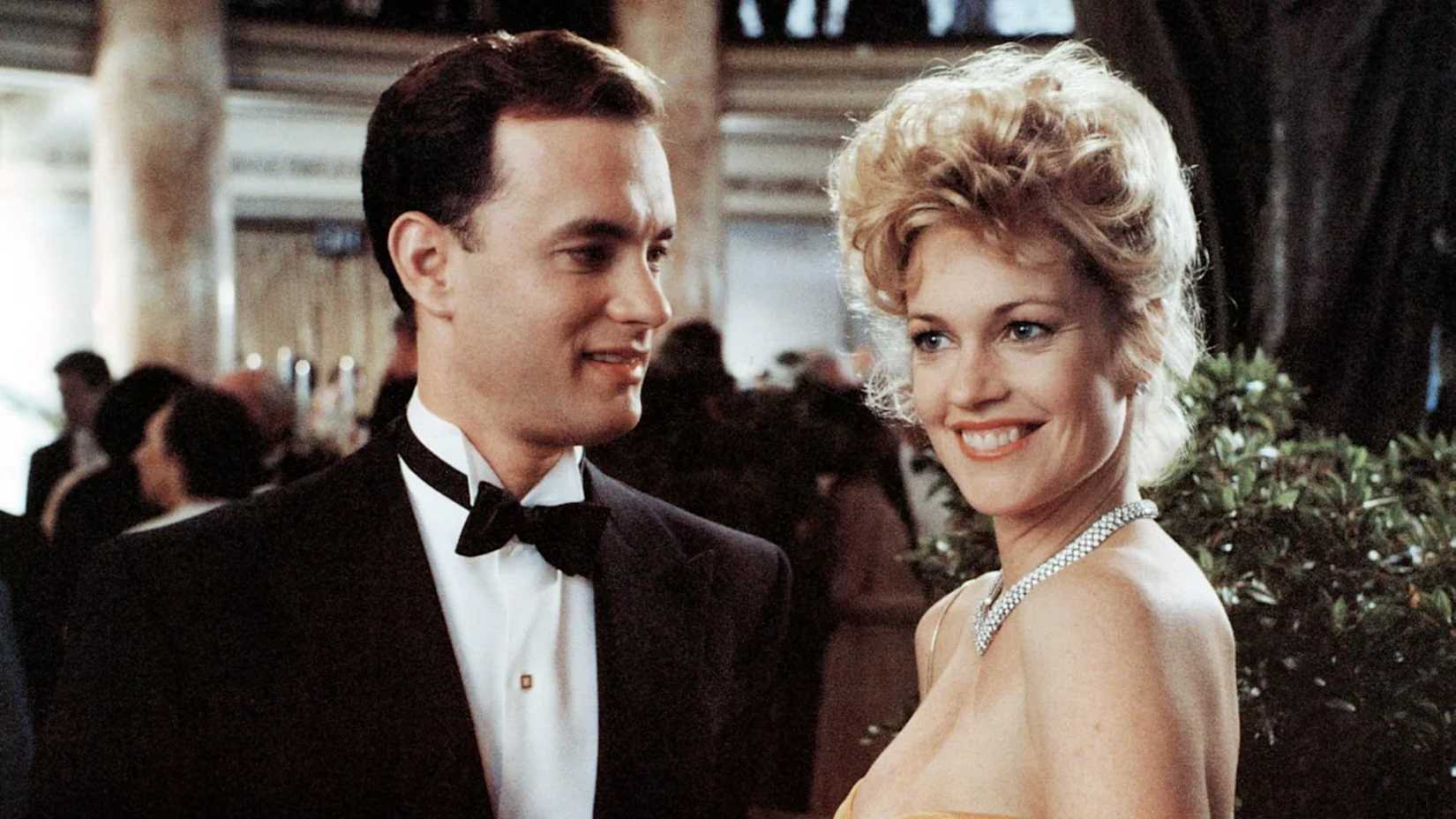 10 Great Actors Who Were Wildly Miscast In Big Movies 3 Tom Hanks smiles at Melanie Griffith in The Bonfire of the Vanities
