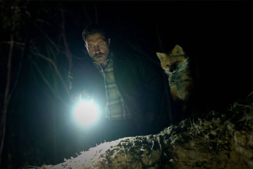 Jai Courtney and the Fox stare down into the pit in The Fox