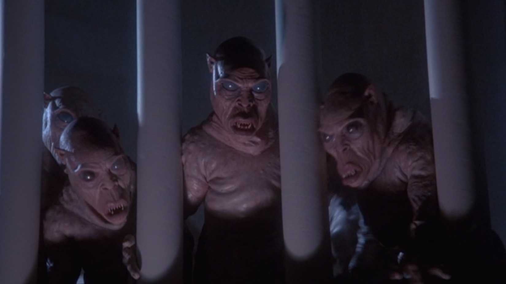 5 Movies That Ripped Off Gremlins, Ranked By Originality 3 The demons peer through bars in The Gate