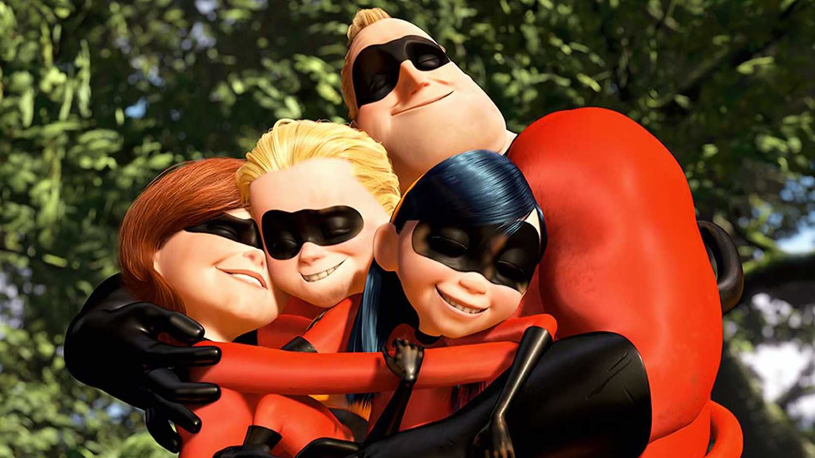 the incredibles family hugging each other in their costumes after a battle