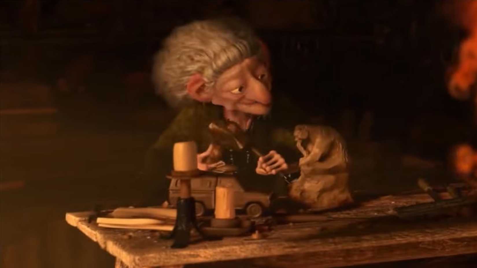 A bruxa em Valente esculpindo uma réplica da van da Pizza Planet