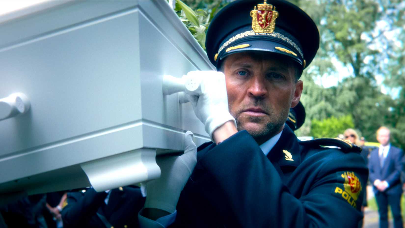 tobias santelmann s harry in his officer uniform helping to carry a casket in jo nesb s detective hole