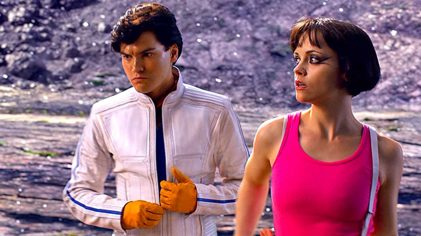 Speed Racer (Emile Hirsch) and Trixie (Christina Ricci) standing together in Speed Racer