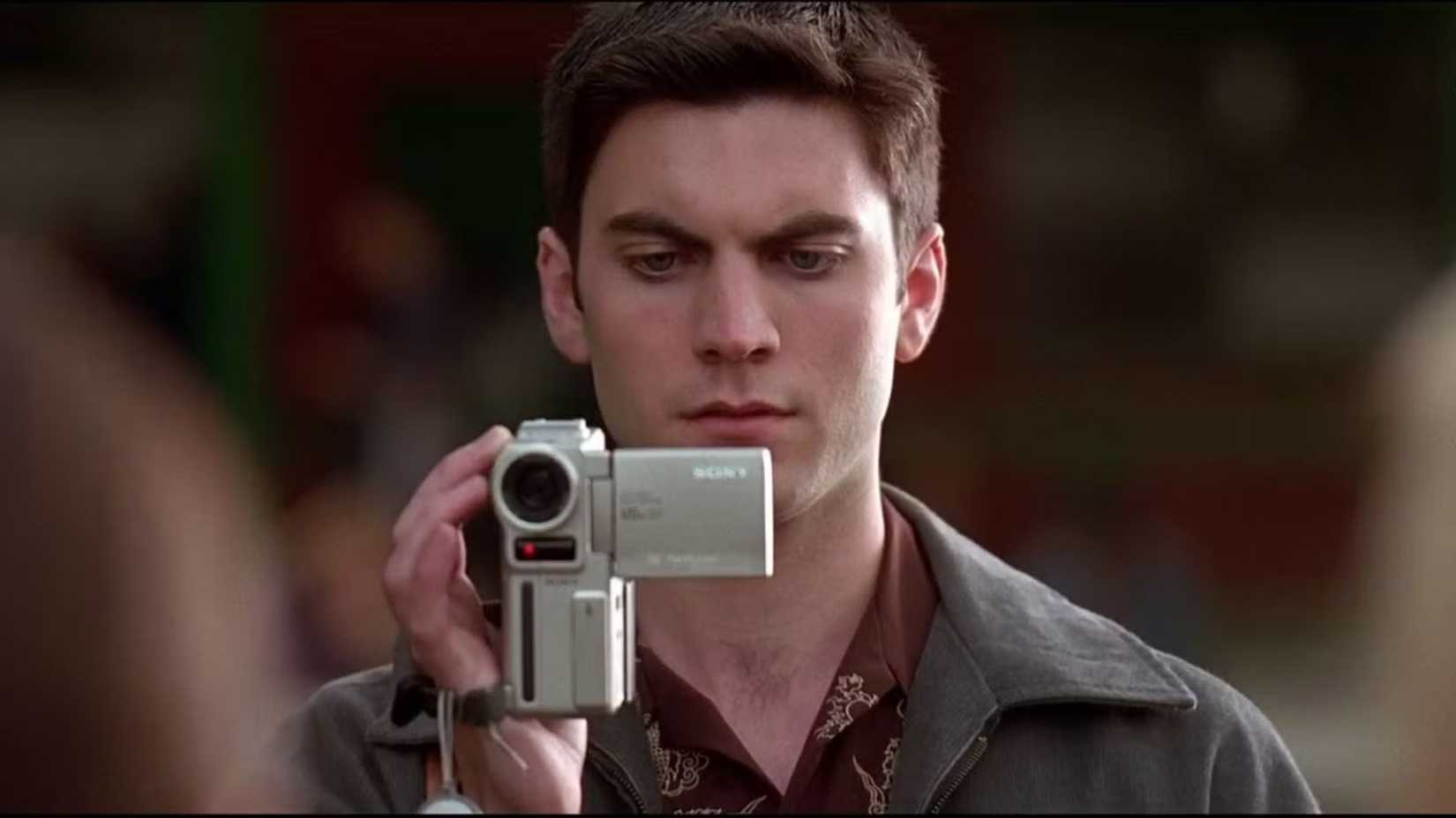 wes bentley as ricky from american beauty holding a video camera