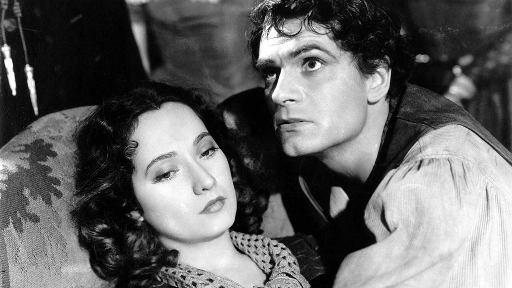 Heathcliff and Cathy embrace in Wuthering Heights