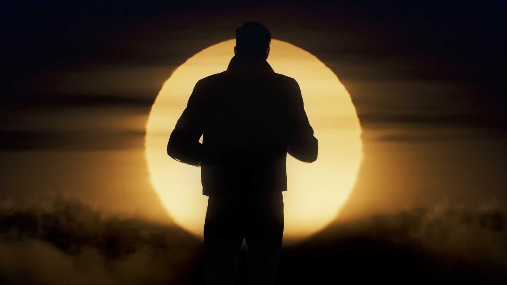 007 First Light James Bond silhouetted by the sun