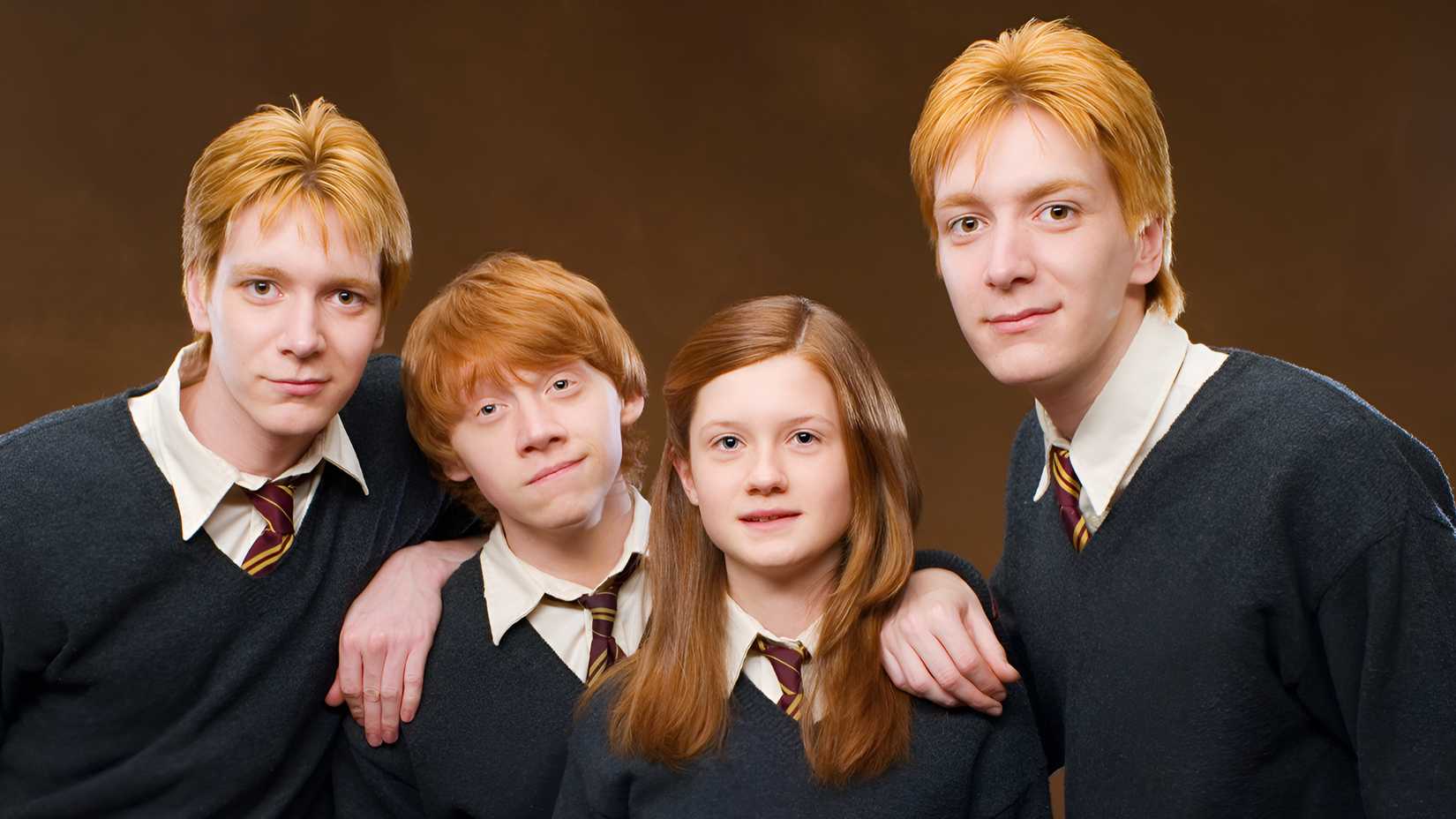 Four children from the Weasley family posing for a picture in Harry Potter