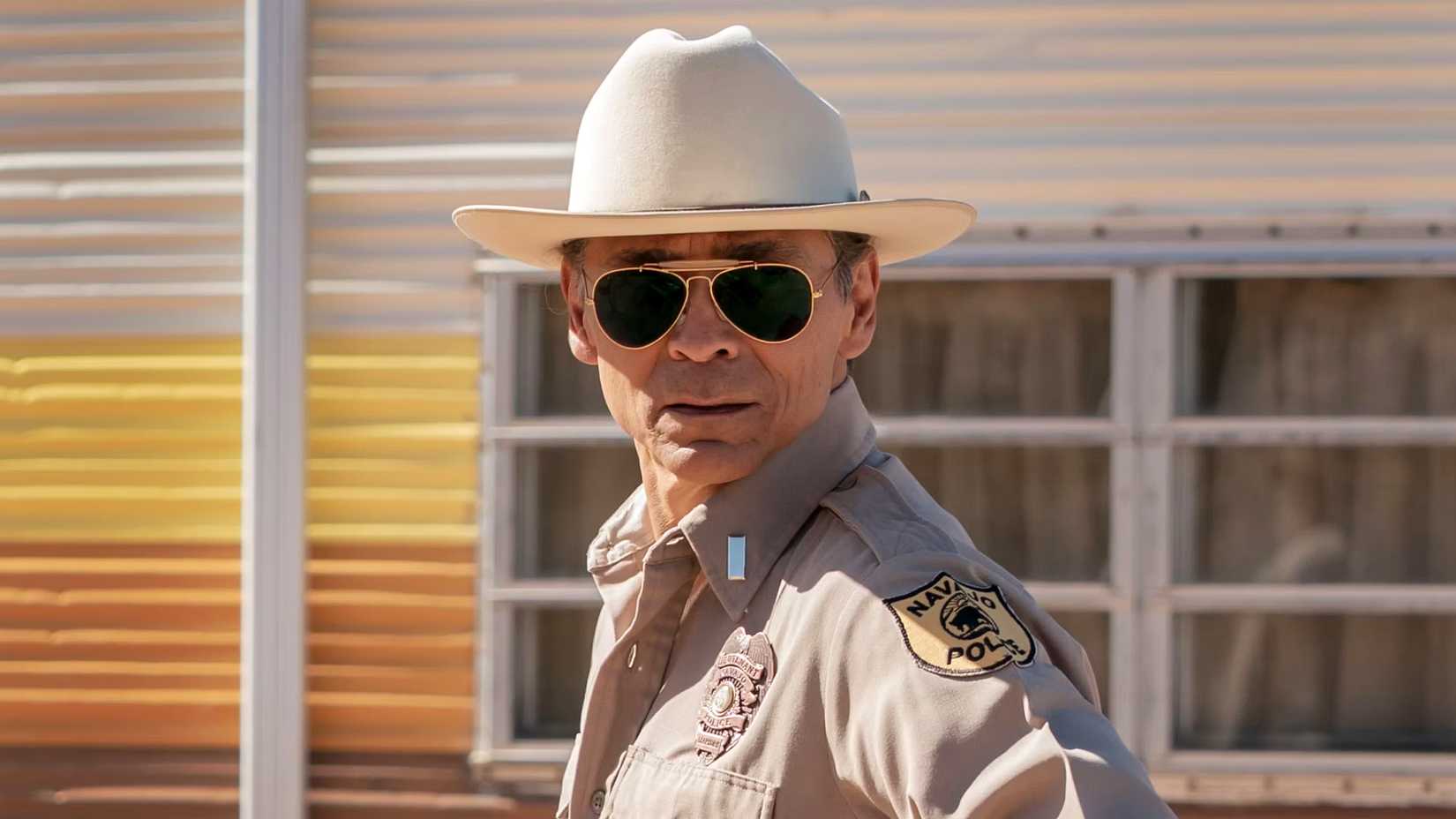 A character wears sunglasses in Dark Winds season 3 episode 1