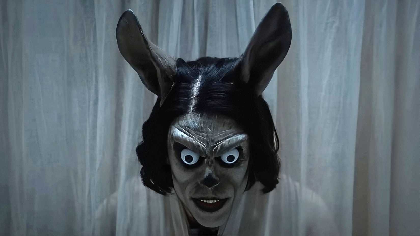 A close-up of an unsettling rabbit creature in Hokum