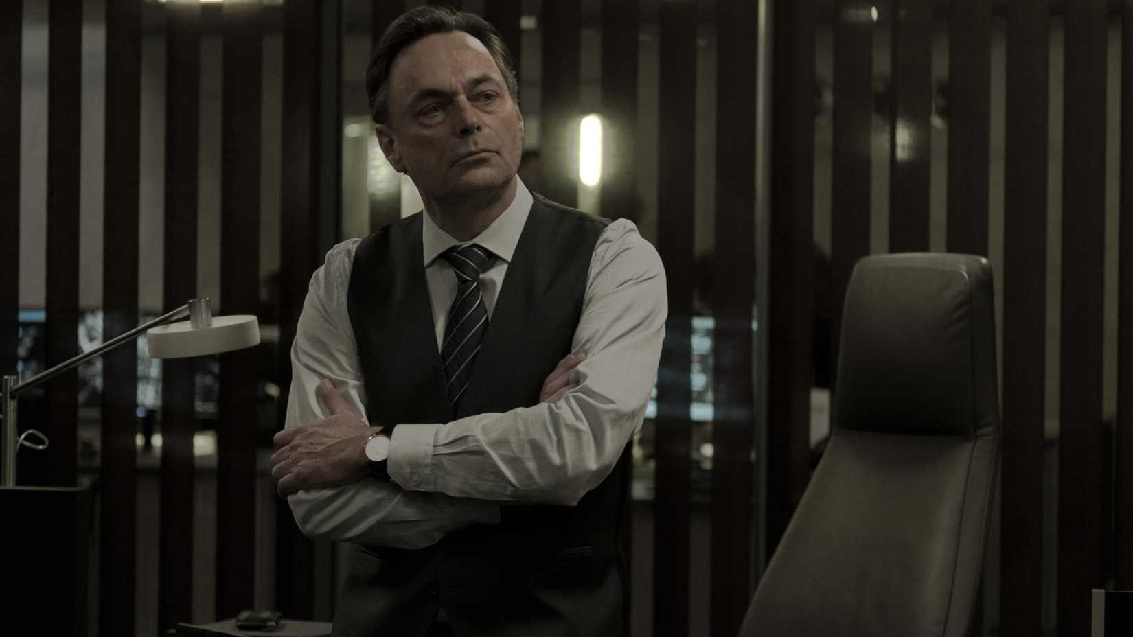 a man with his arms crossed in season 1 of dark