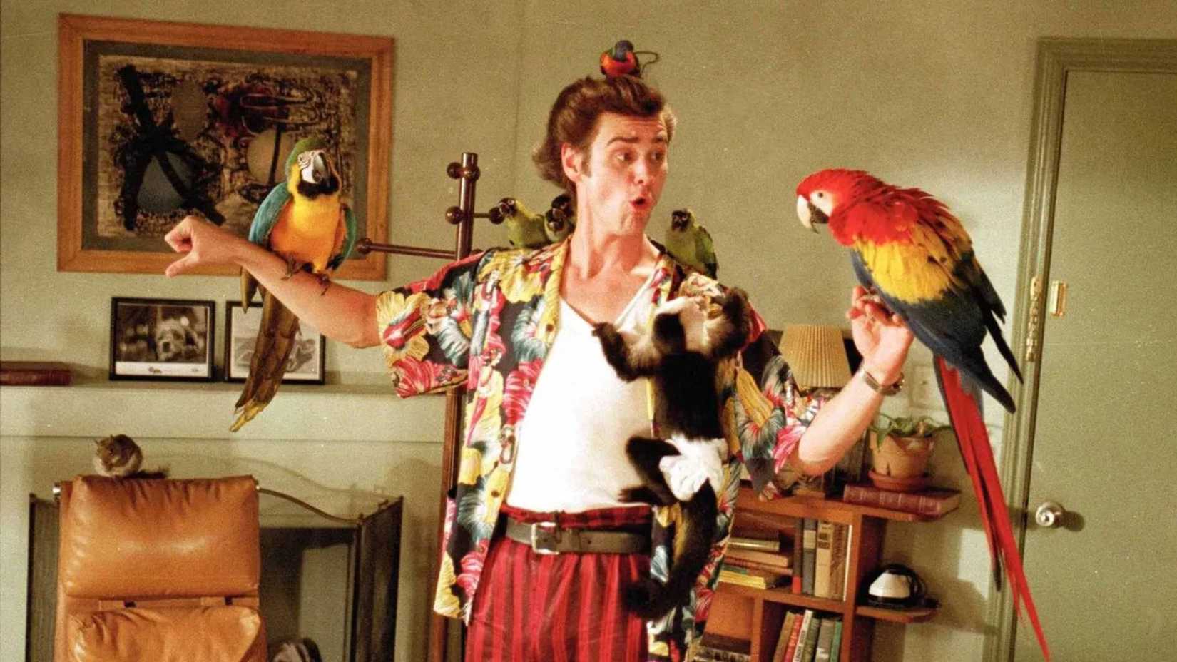 Ace holds a bunch of animals in Ace Ventura Pet Detective