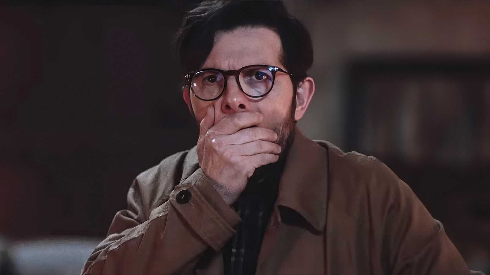 Adam Scott covering his mouth in shock in Hokum