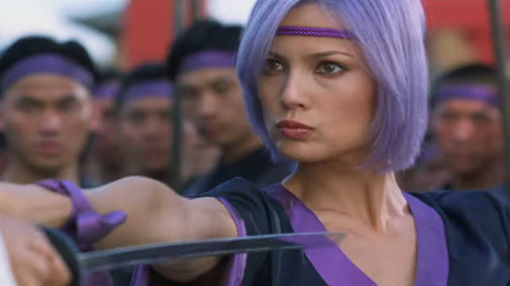 ayane wearing a purple headband swordfighting in doa dead or alive