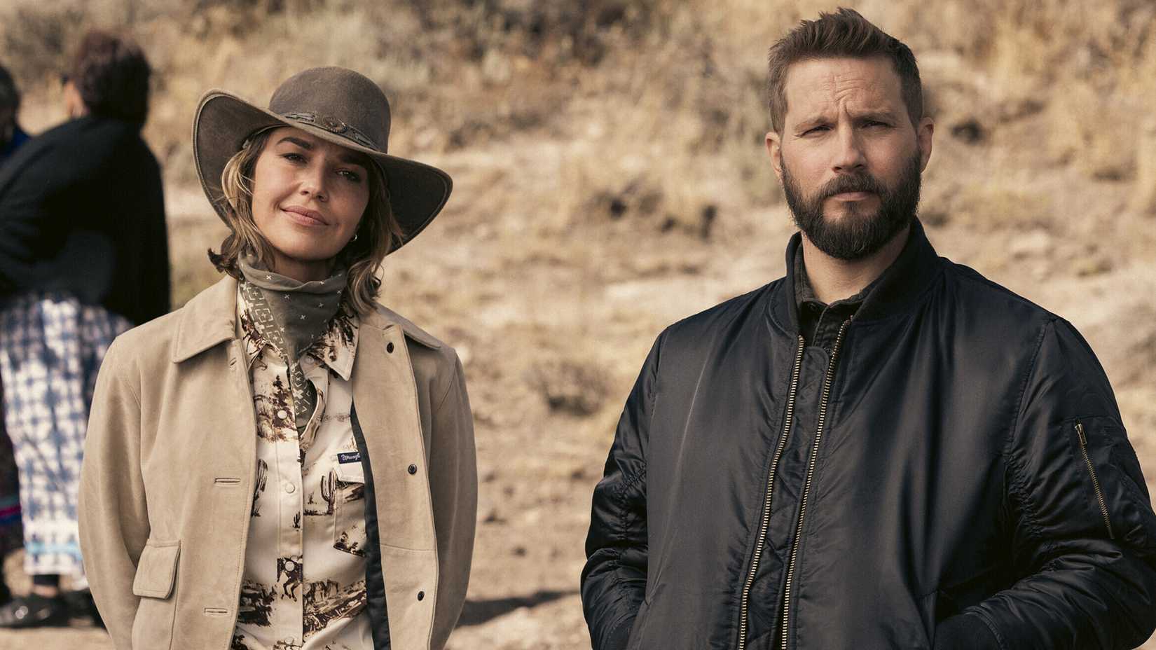 Belle (Arielle Kebbell) and Pete (Logan Marshall-Green) standing together in an episode of Marshals