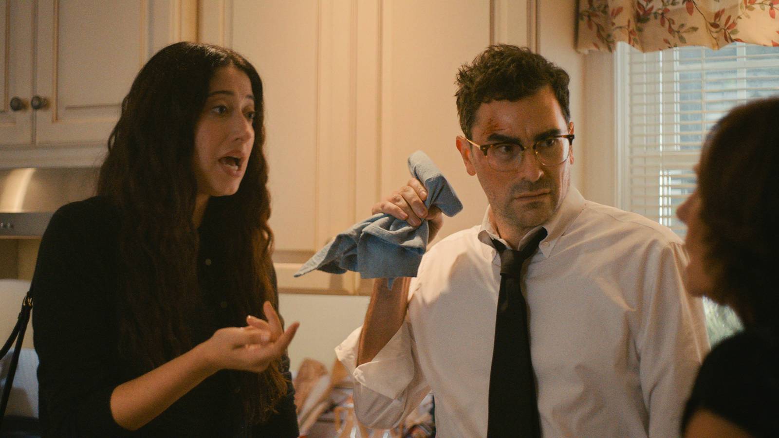 Dan Levy and Taylor Ortega standing in a kitchen in Big Mistakes