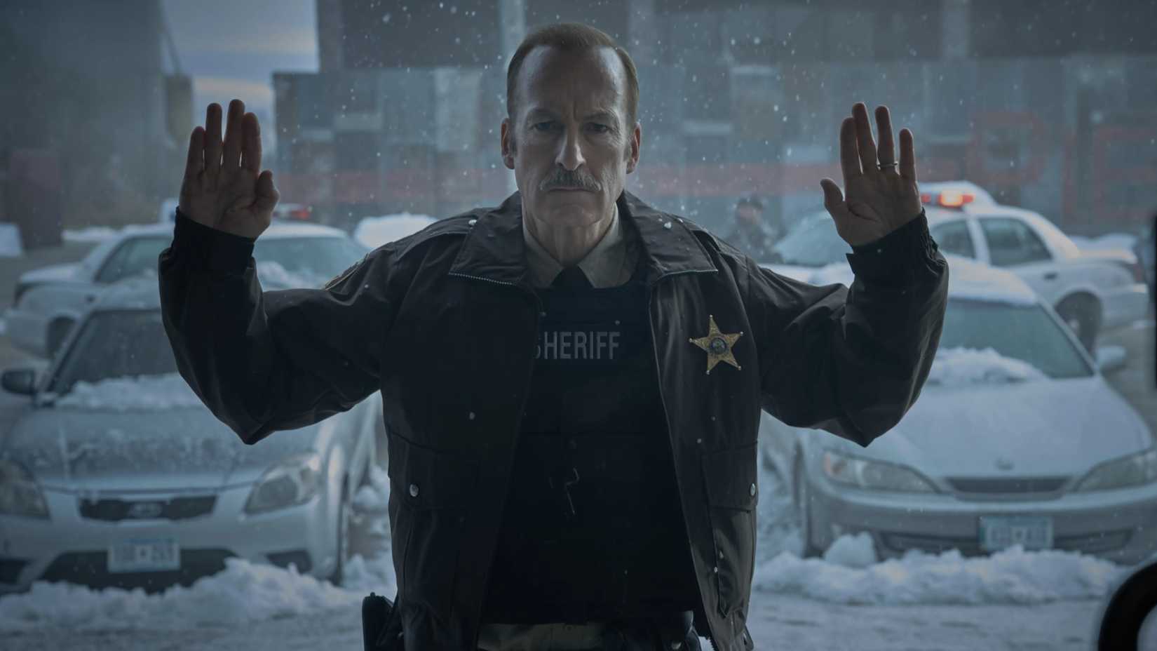 Bob Odenkirk with his hands up in Normal