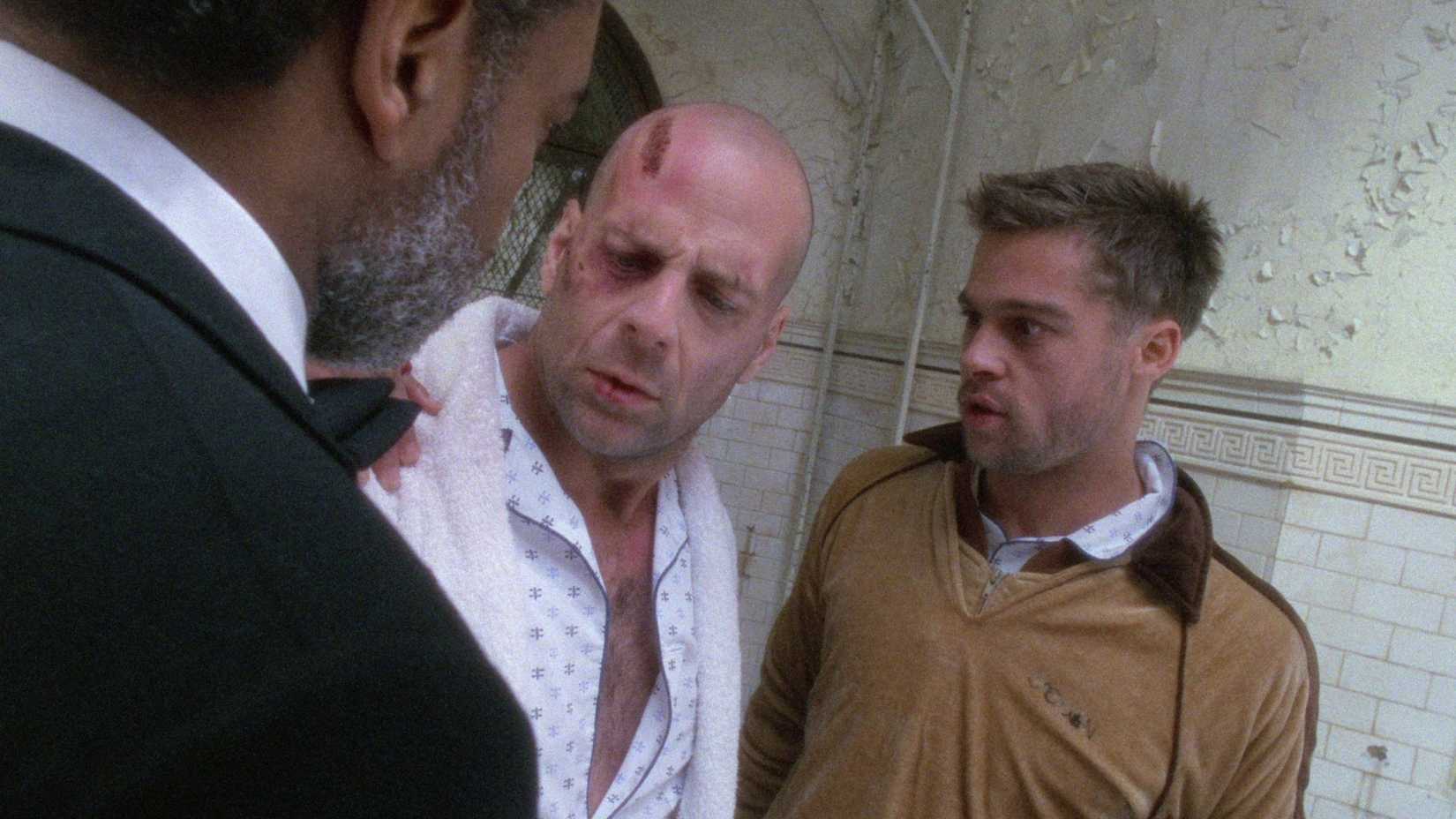 Bruce Willis como James Cole e Brad Pitt como Jeffrey Goines em Os Doze Macacos