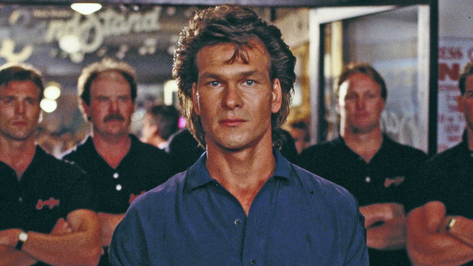 Patrick Swayze’s Dalton  looking intensely in Road House