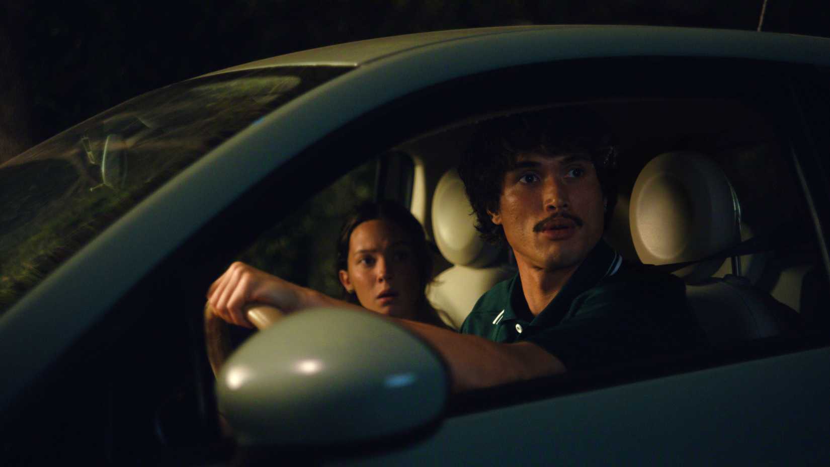 charles melton and cailee spaeny in a car in beef season 2