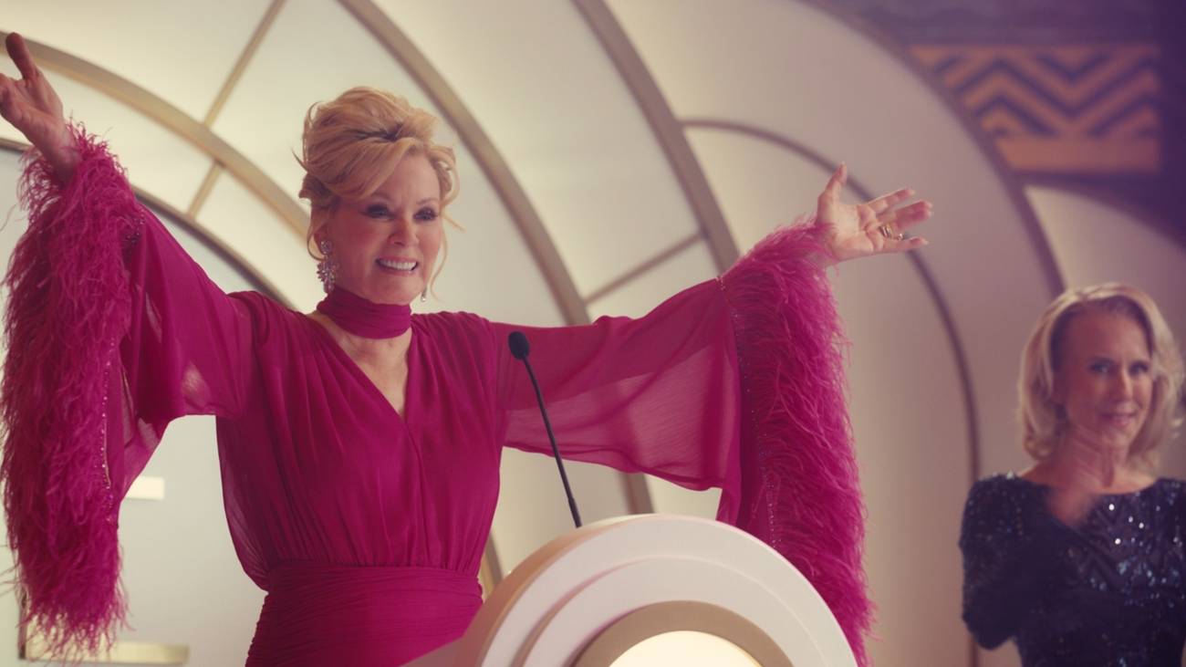 Deborah Vance (Jean Smart) smiling with her arms outstretched in Hacks season 5