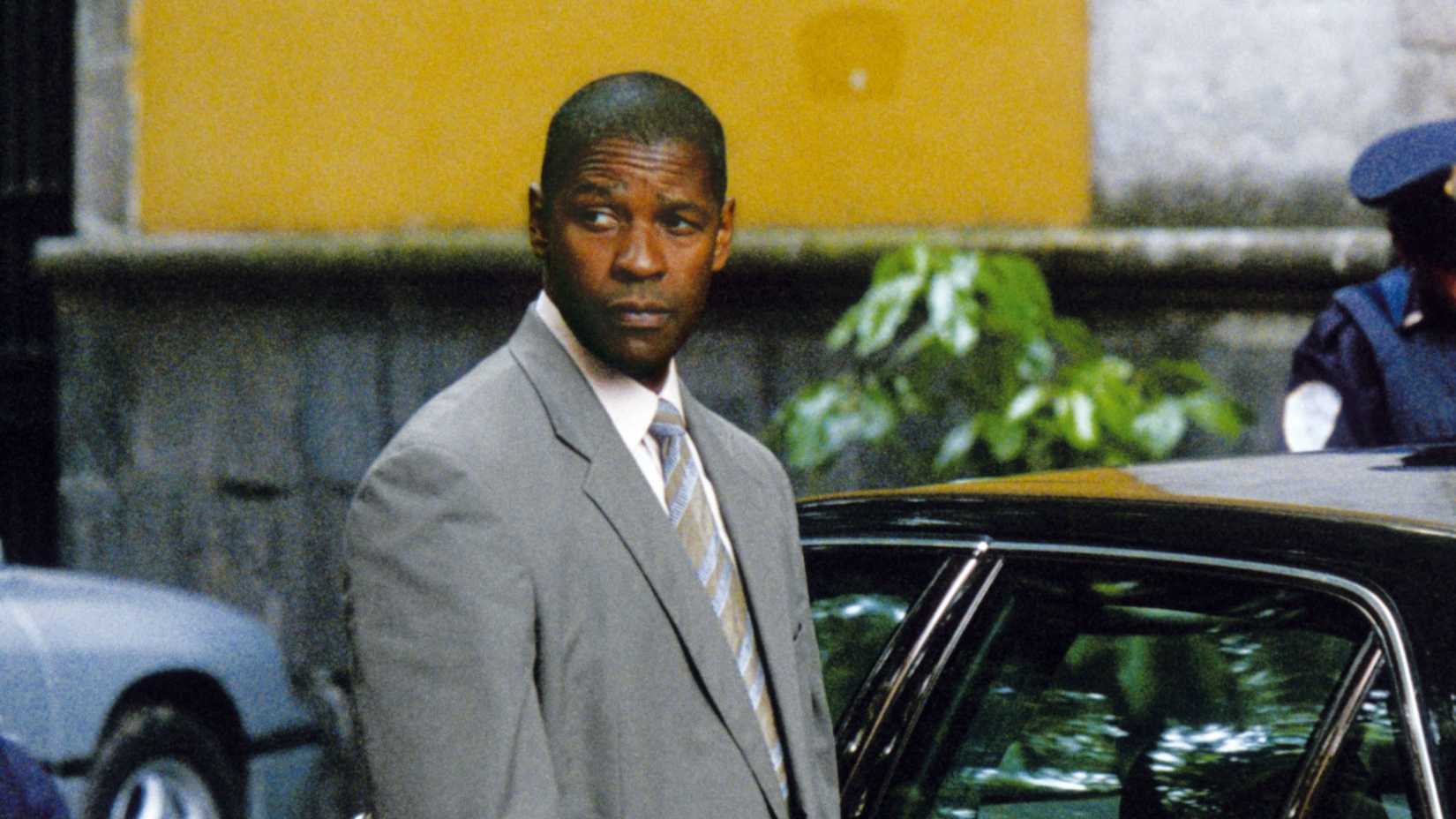 Denzel Washington looks over his shoulder in Netflix's Man on Fire