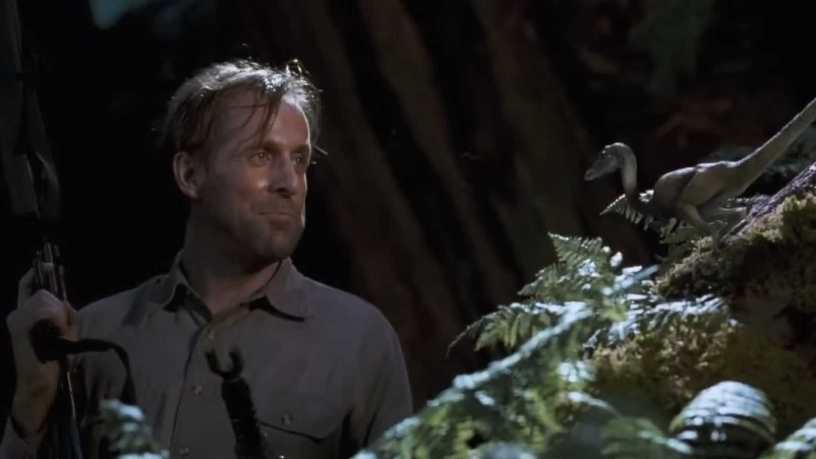 10 Most Shocking Deaths In All 7 Jurassic Park Movies, Ranked 7 Dieter Stark looking frustratedly at a compy in The Lost World Jurassic Park