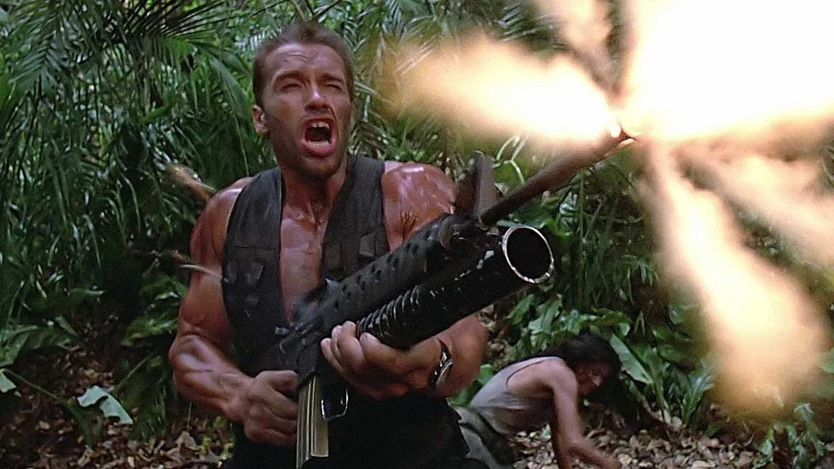 Dutch (Arnold Schwarzenegger) firing an M-16 in Predator (1987)
