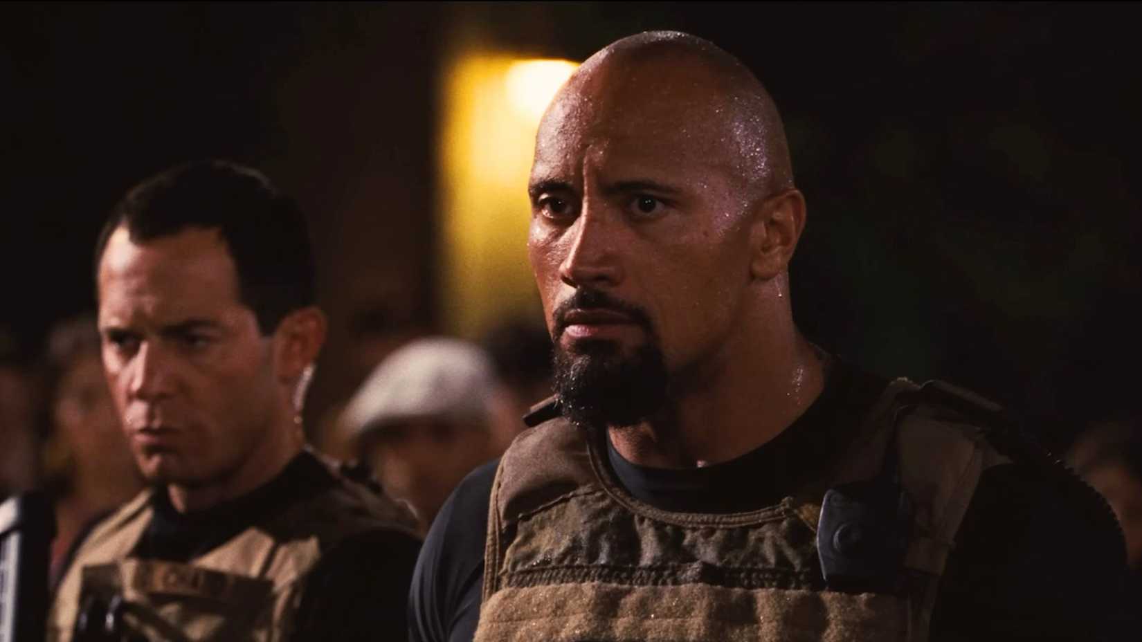 dwayne johnson as hobbs tries to arrest vin diesel as dom in fast five