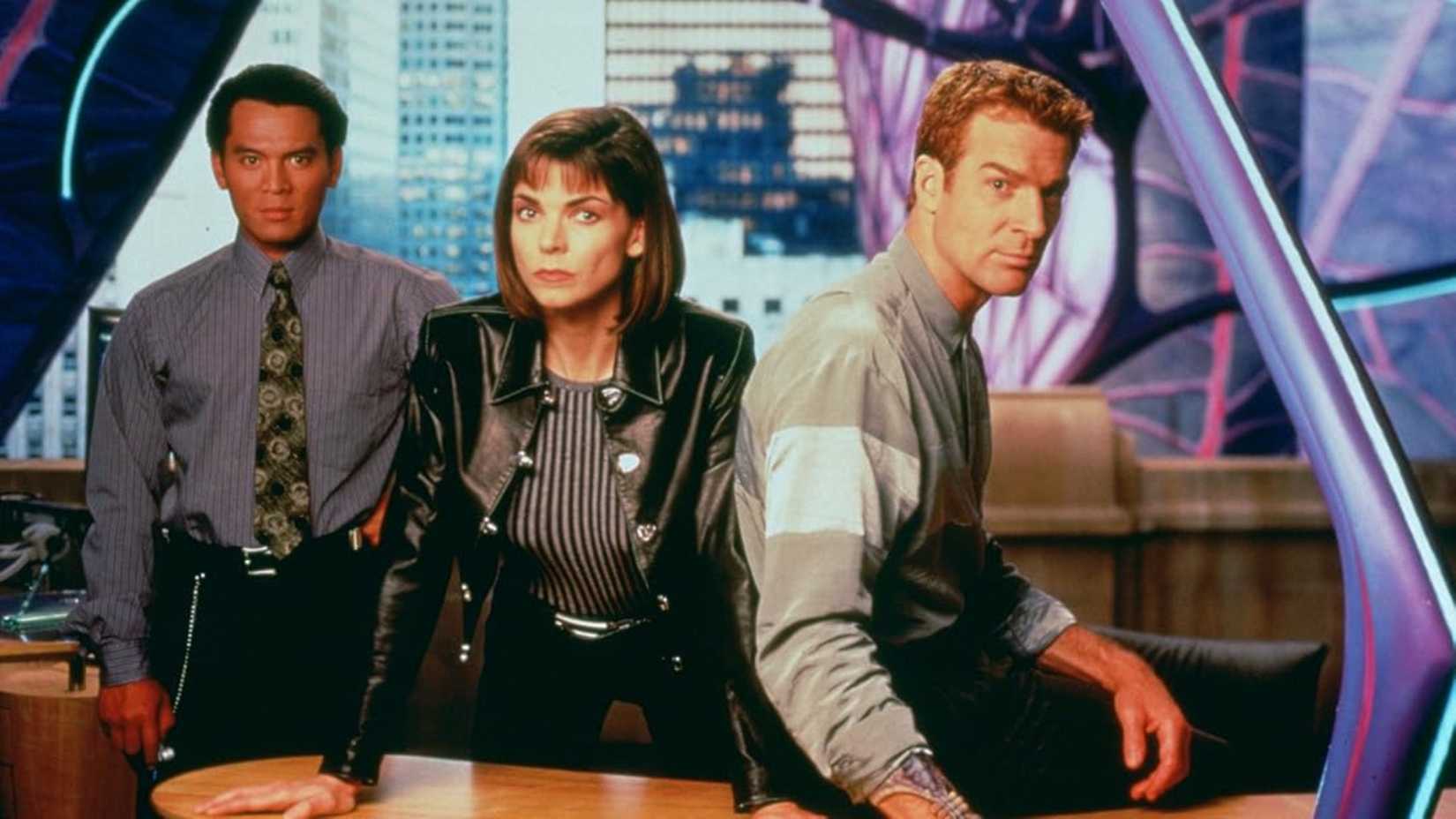 10 1990s Sci-Fi Shows With At Least 5 Seasons 2 The cast of Earth Final Conflict pose at a desk