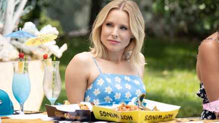 Eleanor Shellstrop (Kristen Bell) wearing a blue sundress in The Good Place