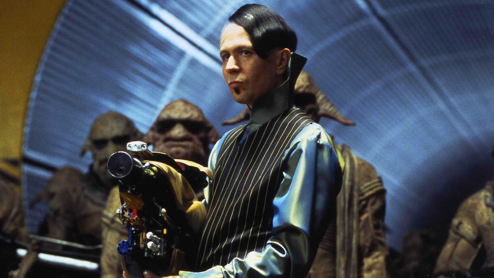 gary oldman aiming a sci fi gun in the fifth element
