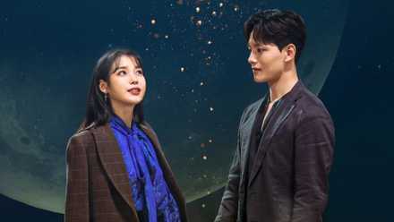 IU and Yeo Jin-goo standing in front of a night sky in Hotel del Luna.
