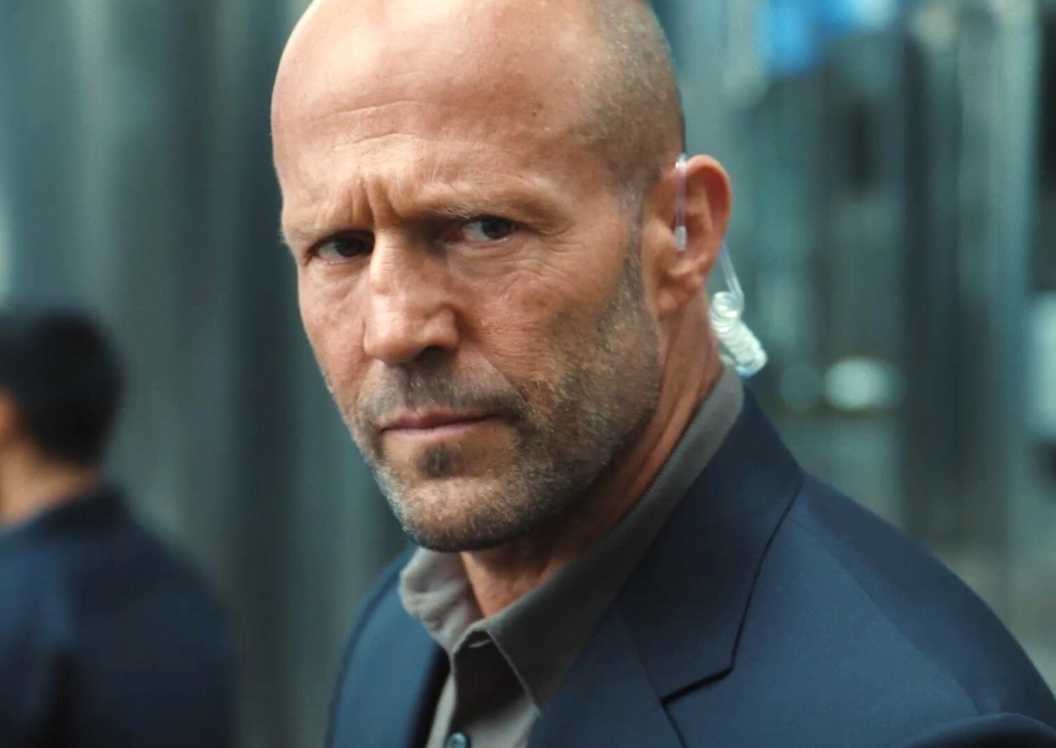 Jason Statham is an agent listening to something in Mutiny
