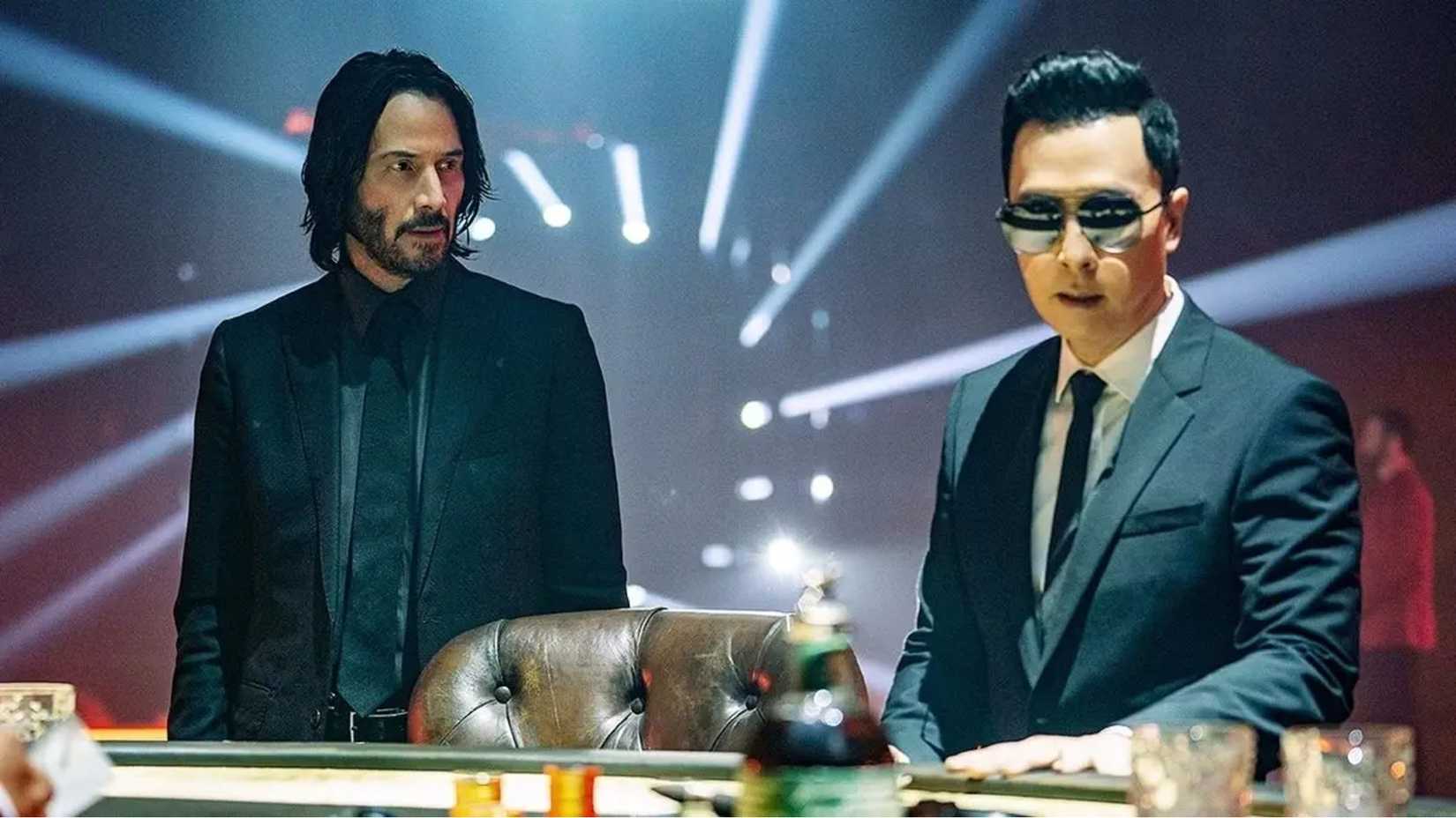 John Wick and Caine stand next to each other in John Wick 