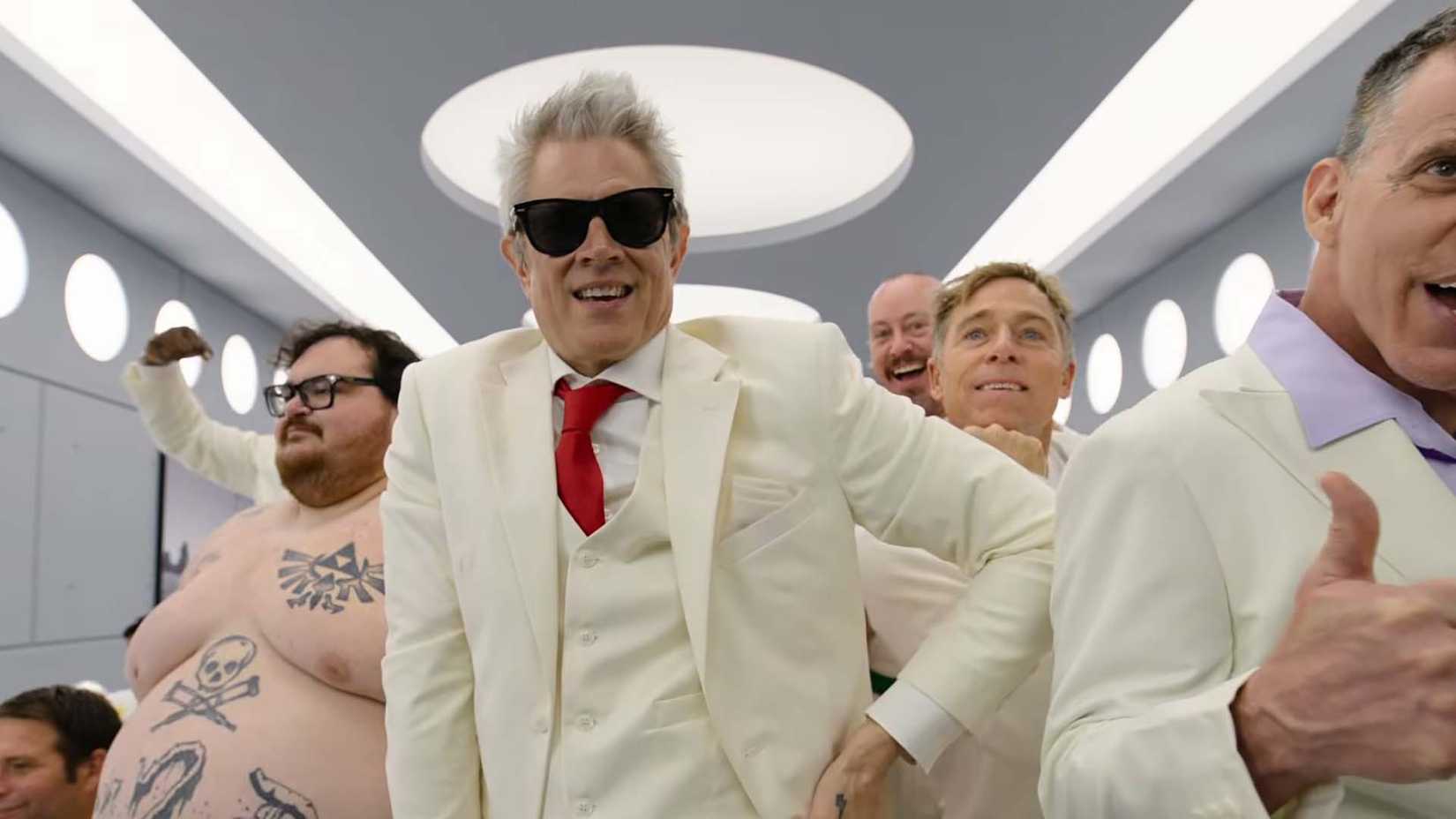 Johnny Knoxville and the rest of the Jackass group posing in an all-white room