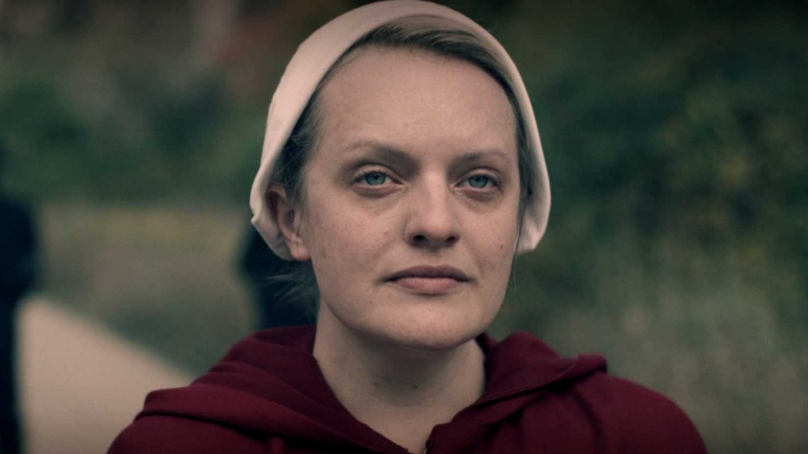 June is looking at Nick in The Handmaid's Tale season 4