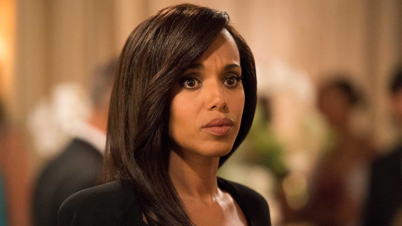 Kerry Washington as Olivia Pope in Scandal season 7. She has a tense look on her face, is wearing her hair straight and has a black top on. 