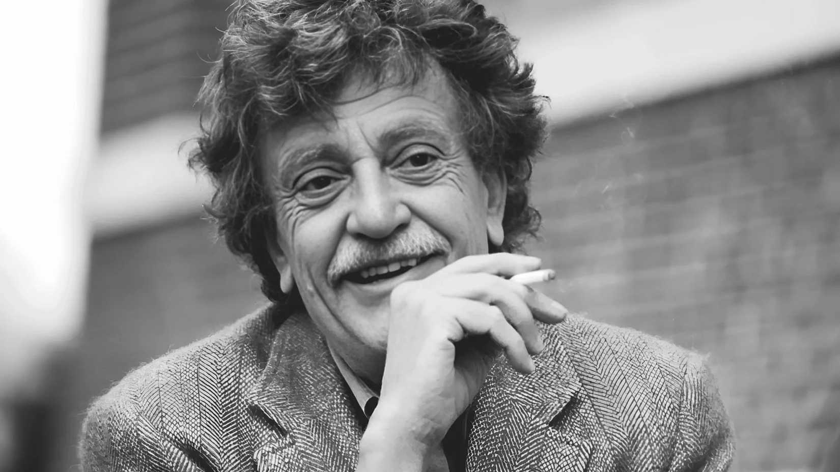 Kurt Vonnegut smiling and smoking