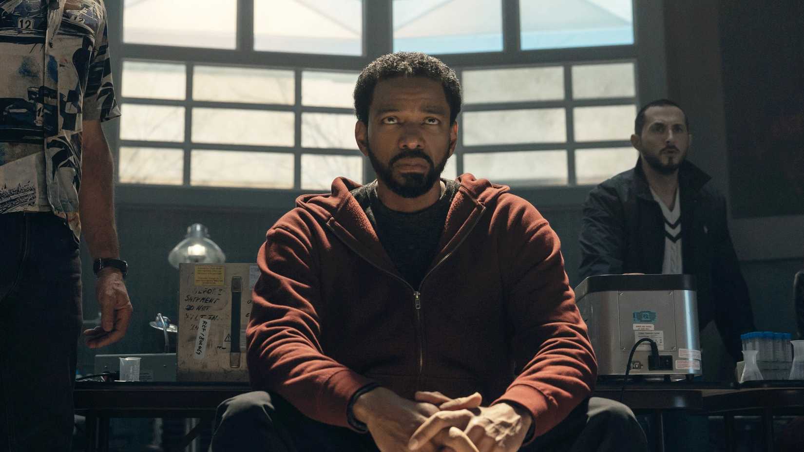 Laz Alonso as MM in The Boys sitting down looking miserable in The Boys season 5