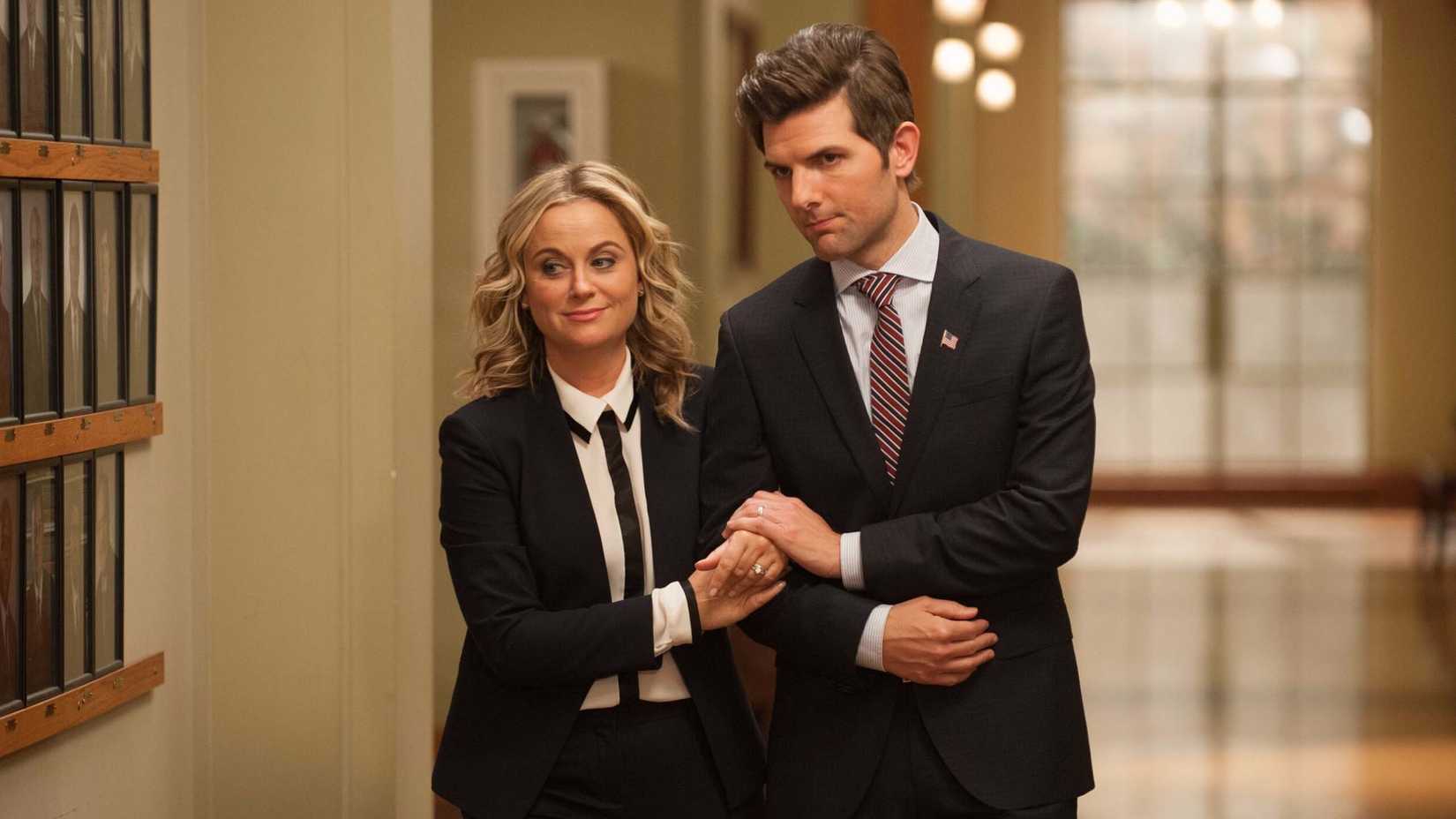 Leslie and Ben link rms and walk down the hall in Parks and Recreation season 7 series finale