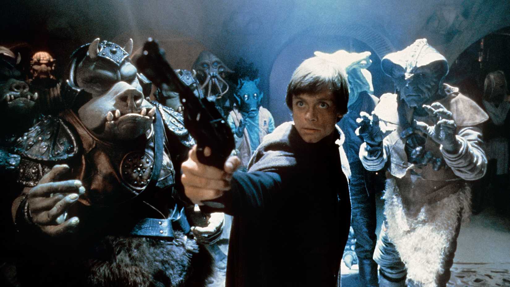 Luke Skywalker pointing a blaster at Jabba the Hutt in Return of the Jedi