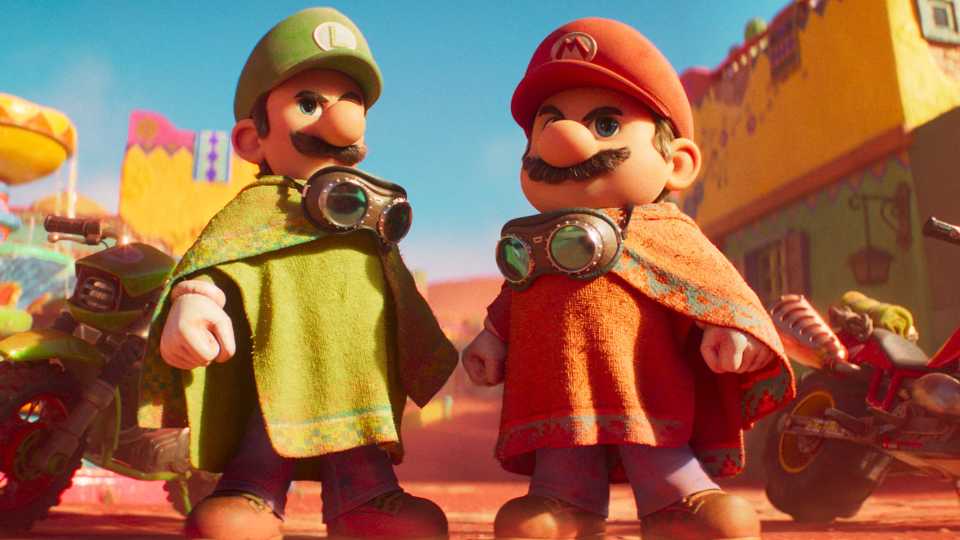 Mario and Luigi wearing ponchos and standing in power poses in The Super Mario Galaxy Movie