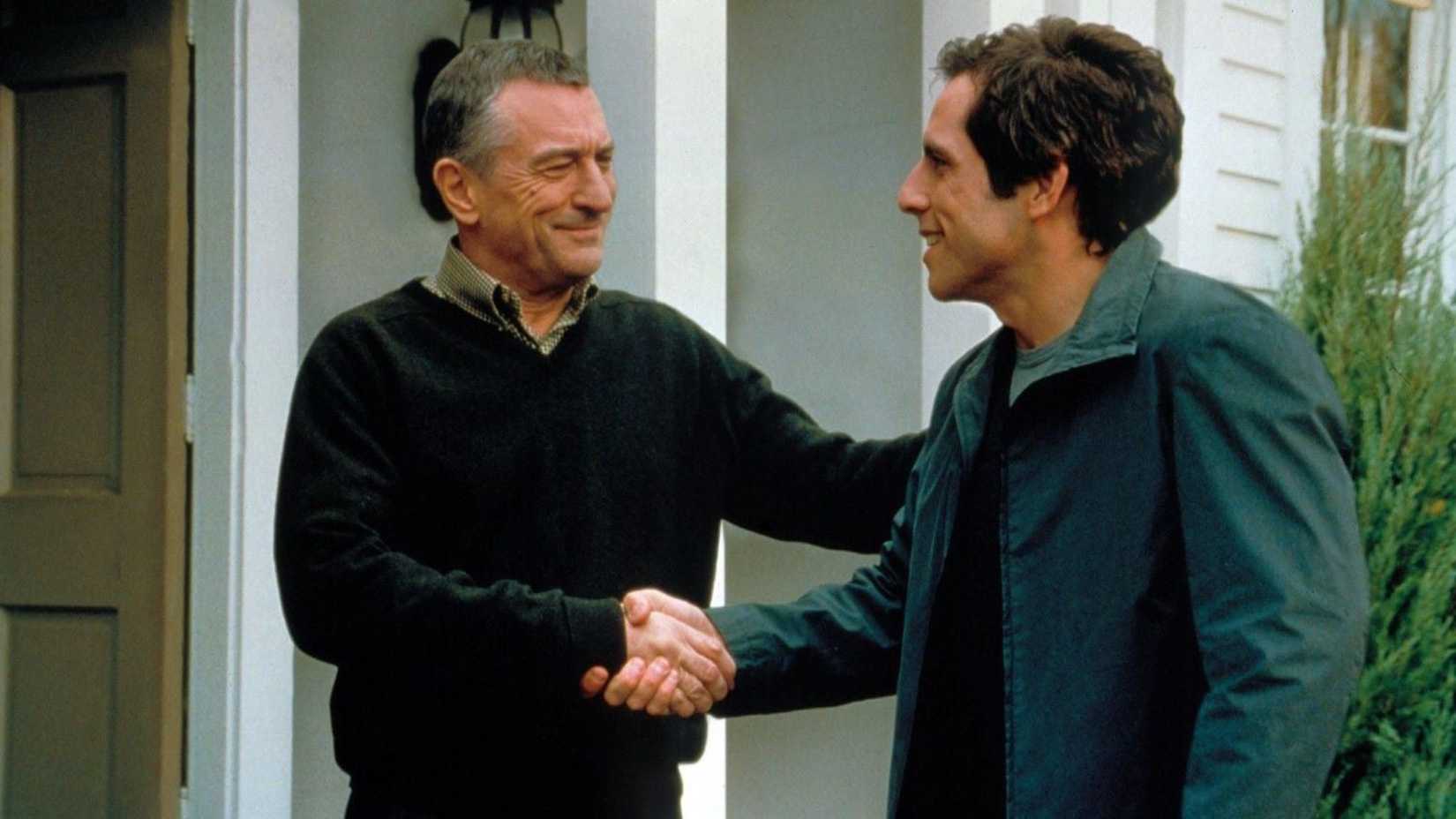 Ben Stiller and Robert De Niro shake hands in Meet the Parents