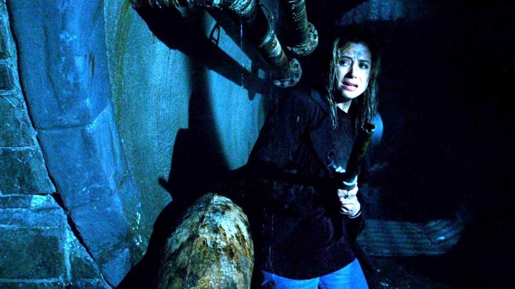 A woman cowering in fear with a mimic