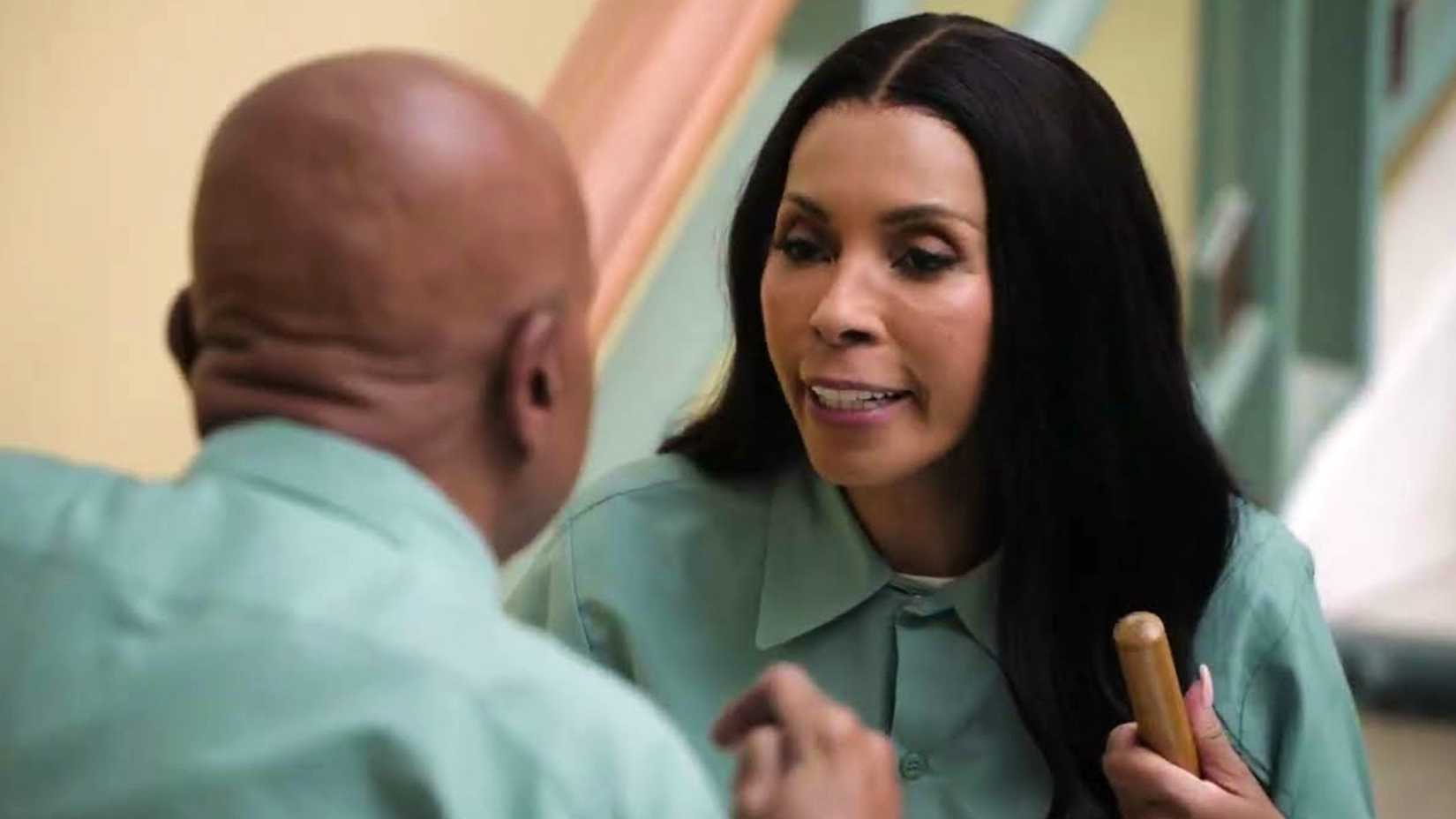 miss carroll speaking to the school janitor in abbott elementary