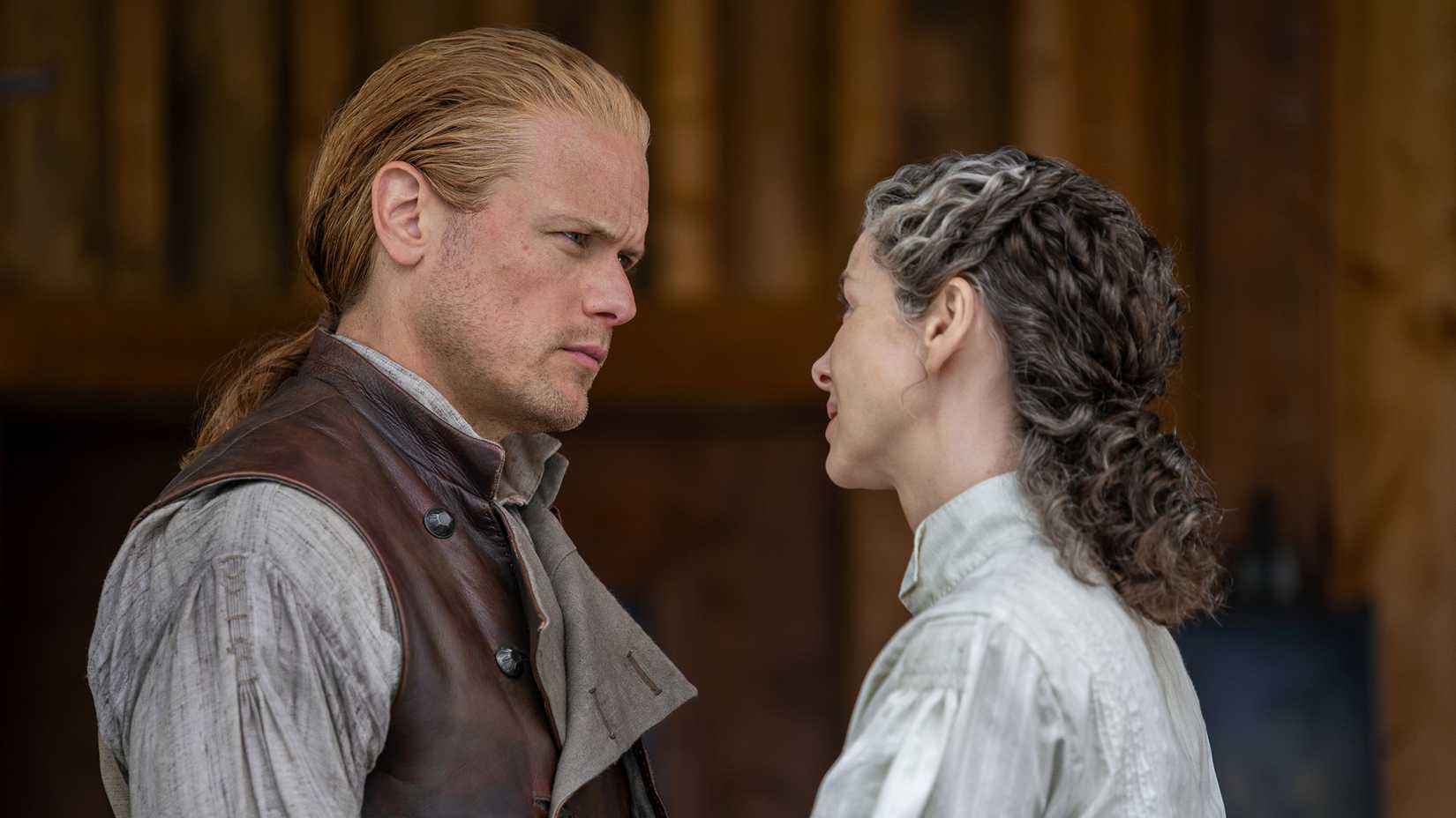 Jamie and Claire looking at each other serious in Outlander season 8
