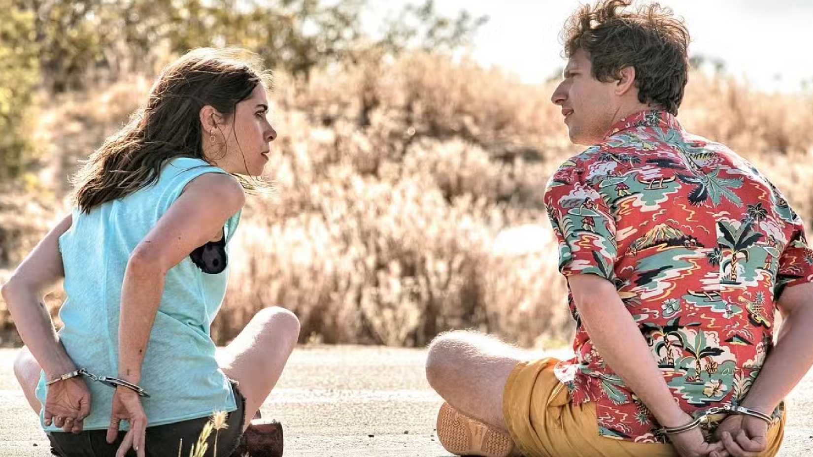 palm springs movie still where the main characters are cuffed